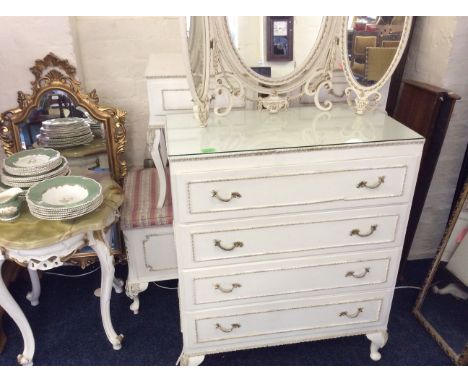 A white and gilt chest of drawers, a free standing mirror, bedside tables, storage box, gilt framed wall mirror, white and gi