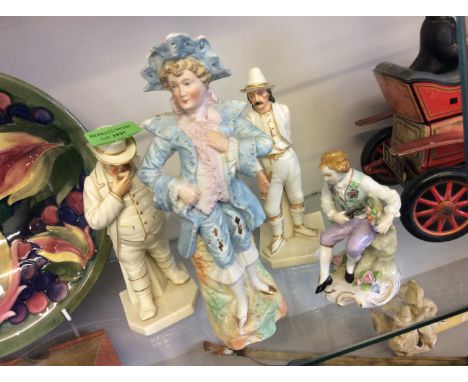 Four ceramic figurines.