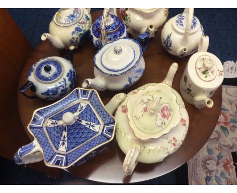 Nine decorative tea-pots, including Masons, Worcester and Doulton.