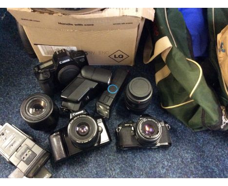 *A collection of photographic items, cameras, spot light etc.