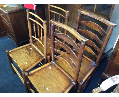 Four elm kitchen chairs, one ladder back pair.