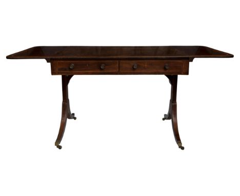 Property of a lady Late 18th / Early 19th Century A mahogany sofa table Tulipwood banded and boxwood strung. With curved ends