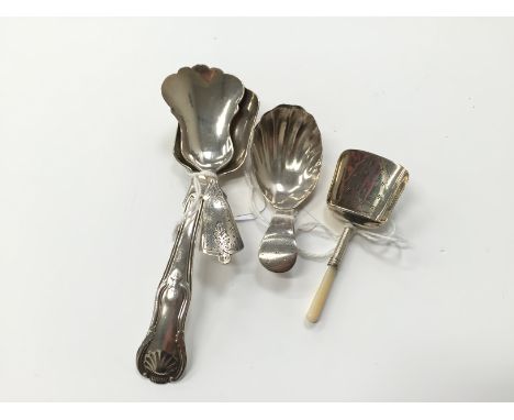 A Yapp & Woodward Queens pattern long handled caddy spoon, a Victorian caddy spoon with fluted decoration, a Georgian design 