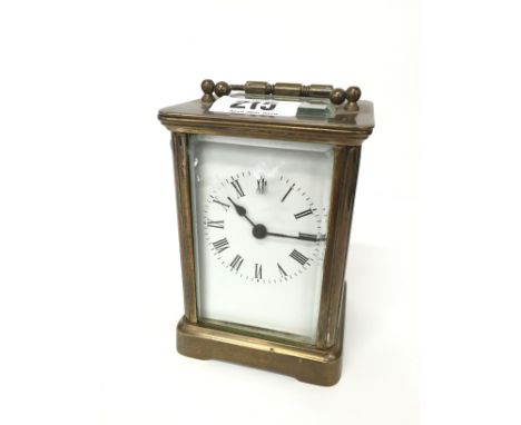 A French glass cased carriage clock with enamelled face (12cm) (chipped bezel)