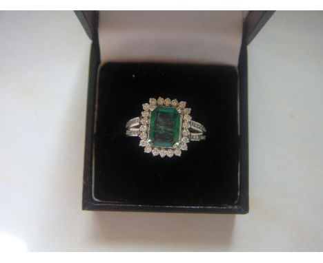 A fine 1.89 carat Columbian emerald and 0.83 carat VS1 diamond ring in 18 carat white gold.
(R5)