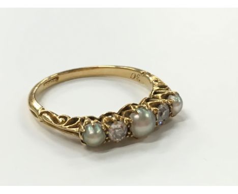 An 18 carat gold antique pearl and diamond ring.