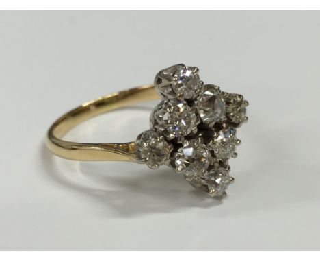 An Art Deco 18 carat gold and platinum set eight stone diamond ring (approx. 1.5 carats).
(R4)