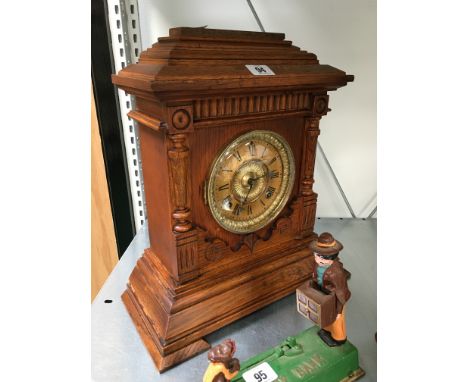 A late 19th century oak cased mantle clock.