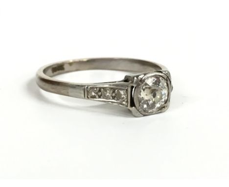 An 18 carat white gold solitaire diamond ring