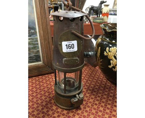 A brass and iron miner's lamp, Type SL No. 83.