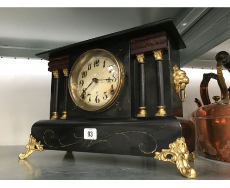 A 19th century American black painted wood cased mantle clock.
