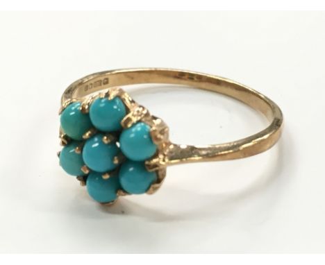 A 9 carat gold turquoise stone cluster ring.