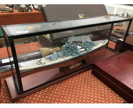 A King George V model of a Naval Gunboat in glazed case.