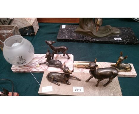 A French bronzed calendar mounted with seated deer, a similar study with two deer on variated marble base and a 1930's design