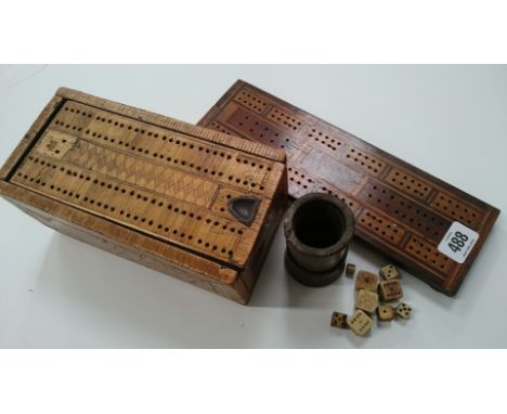 An 18th century straw work cribbage box containing a set of ivory red and white draughts, mahogany and boxwood cribbage board