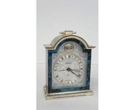 A Swiza miniature mantle clock with faux lapis lazuli case.