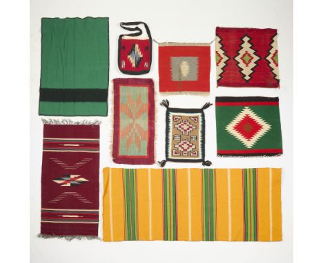 Group of nine Native American and Mexican textiles, 20th century. Including saddle blankets, serapes, rugs or carpets, and a 