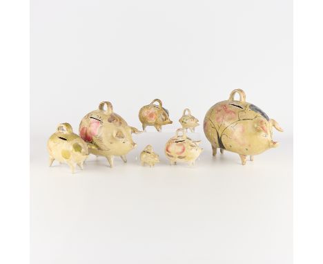 Group of seven vintage Mexican folk art Tlaquepaque, Jalisco tourist pottery molded pig banks, ca, 1930s-1940s.For similar ex