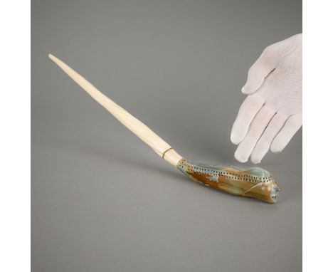 Leah Olatitaq Kalluk, Inuit. Cribbage board carved as a sotne transformation figure, morphing back into a narwhal tusk. Witho