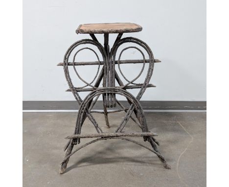 Adirondack table made from curled twigs and branches. Wood tabletop with twig border. Great as a table or plant stand!Height: