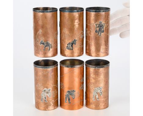 Taxco, Mexico. Set of six copper tumbler cups with silver inlay depicting figures and burros. Stamped mark along the undersid