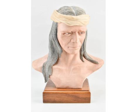 Porcelain bust style sculpture by Edward J. Rohn depicting a Native American with long grey hair and wearing a beige headband