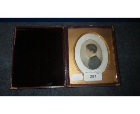 A late 18th/early 19th century miniature watercolour profile portrait of a young boy in a frame with gilt slip and hinged lea
