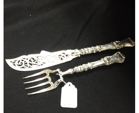 A Victorian silver serving knife and fork with engraved and pierced blades
