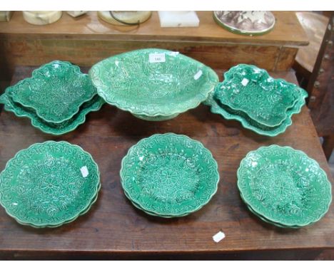 A 19th century green glazed dessert service with embossed decoration with impressed mark, 'DON POTTERY' beneath