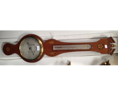 A reproduction mahogany wheel barometer