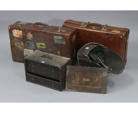 A copper helmet-shaped coal scuttle, 12” high; together with a tool chest; &amp; two suitcases.