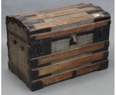 A fibre-covered ribbed domed-top travelling trunk with hinged lift-lid, 32” wide x 22” high x 19” deep, (w.a.f.); a pine four