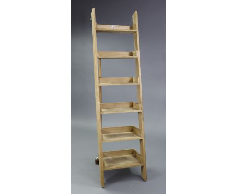 A light oak tall six-tier lean-to shelf unit, 18¾” wide x 71” high.