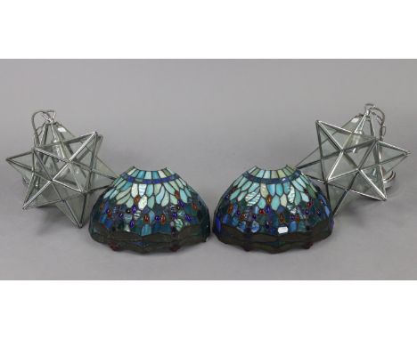 A pair of leaded &amp; mottled glass wall lights of demi-lune form &amp; with dragonfly decoration, 12½” wide x 8” high; &amp