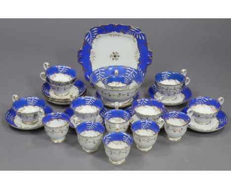 A late Victorian china twenty-six piece part tea &amp; coffee service of white ground with blue borders having foliate decora