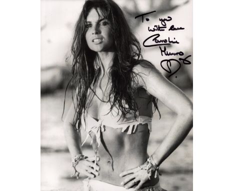 Caroline Munro James Bond actress signed 10 x 8 inch black and white sexy outfit photo. English actress, model and singer kno
