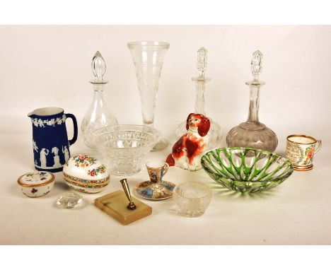 A collection of decorative glass and ceramic itemsTo include two early 20th Century bulbous decanters, a bottle decanter, a t