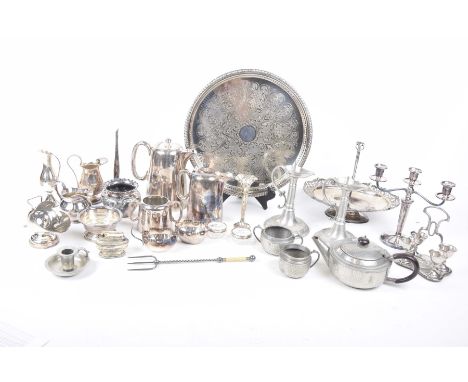 A collection of silver plated wareTo include a hammered pewter compressed teapot, hotel ware plated sugar helmet, an openwork