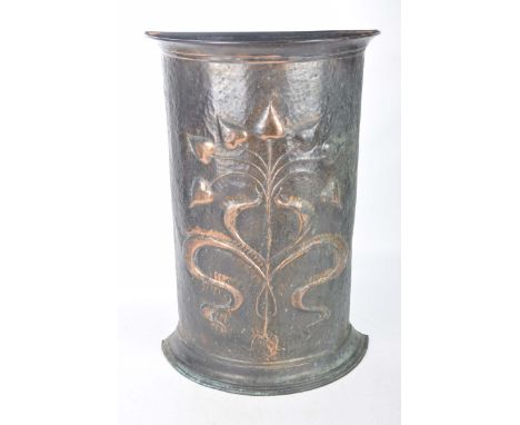 An early 20th Century Art Nouveau copper stick standOf demi Lune form embossed with stylized leaves and scrolls upon a plinth