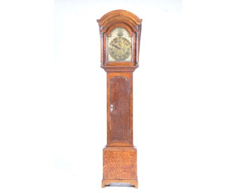 An 18th Century and later oak and mahogany cross banded longcase clockWith a later arched pediment above a brass eleven inch 