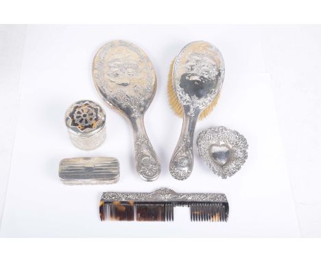 An Edwardian silver hand mirror and hair brush setEmbossed with putti, by Henry Matthews, Birmingham 1901, together with, a s