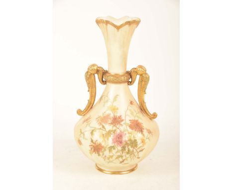 A Royal Worcester blush ivory two handled vaseOf swelling form with a gilt embellished wavy rim above a pair of leaf moulded 