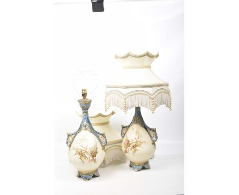 An impressive pair of Royal Worcester blush ivory table lampsEach of tapering bulbous form with applied reticulated handles f