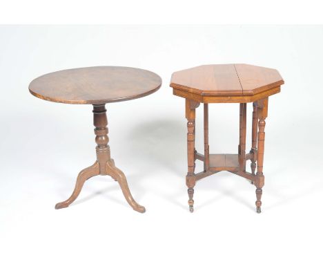 A George III mahogany tripod table and a Victorian walnut occasional tableThe Georgian tripod with a circular top supported o