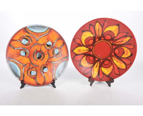 Two mid 20th Century Poole chargersEach decorated in abstract shades either orange or red, 40cm.