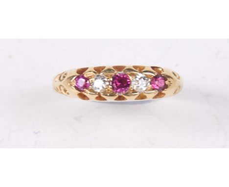 A ruby and diamond ringThe alternating old-cut diamonds and rubies to an 18ct gold shank, weight 2.9g