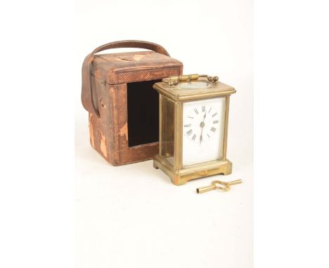 An early 20th Century brass cased carriage clockWith an enamelled dial, black Roman numerals, the movement stamped with S & F