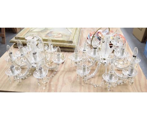 Two cut glass and droplet ceiling light fittingsThe first with a baluster central shaft flanked by an upper tier of four ligh