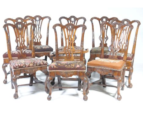 An exceptional set of nine George II walnut dining chairs, possibly IrishPossibly Irish,each with a central C scroll leafy ci