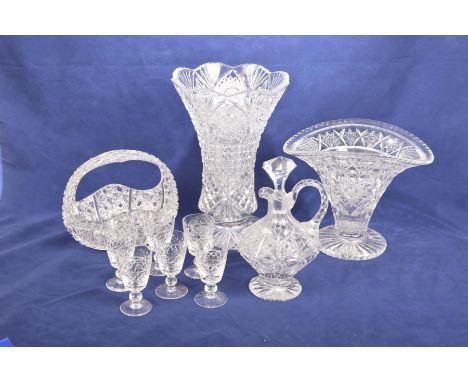 A collection of cut glass itemsTo include a substantial trumpet shaped vase with a scalloped border, a second cut glass vase,